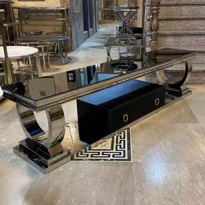 میز tv استیل به رنگ نقره ای با رویه شیشه